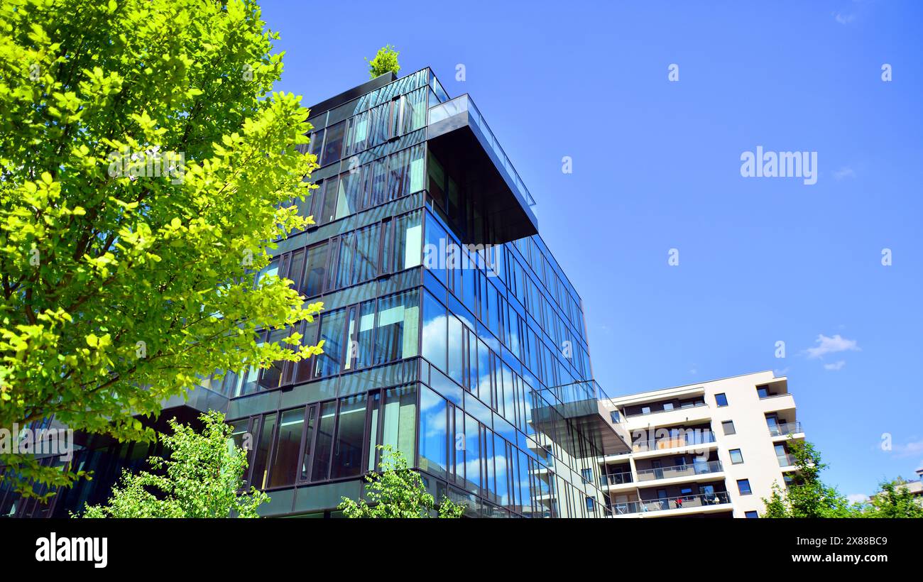 Sustainable glass office building with trees for reducing carbon ...
