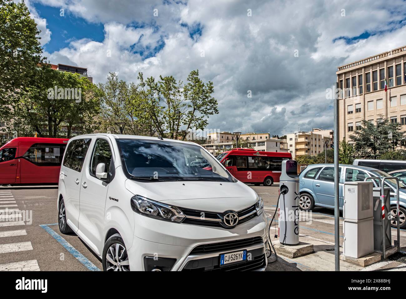 White Toyota Proace Verso Electic, SUV Charging at Electric Vehicle Station Stock Photo