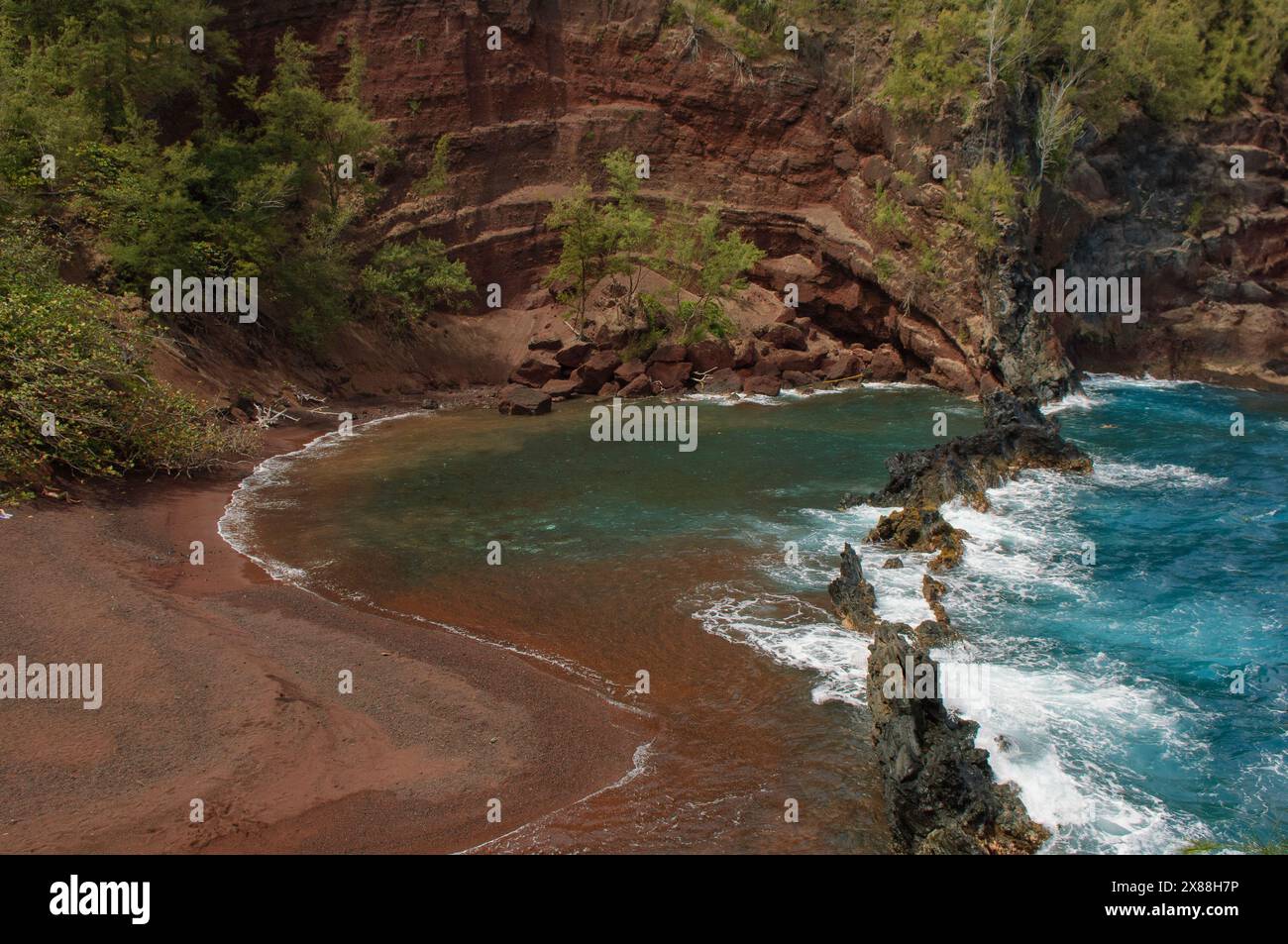 Kaihalulu Beach, AKA Red Sand Beach, on the Hana Coast of Maui, Hawaii. Stock Photo