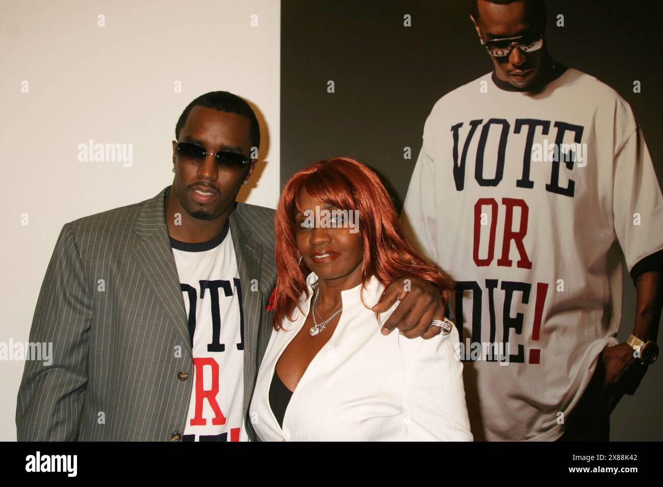 Sean 'P. Diddy' Combs and Janice Combs attend P. Diddy's Citizen Change Political Art Exhibit Campaign at Tony Shafrazi Gallery in New York City on September 29, 2004.  Photo Credit: Henry McGee/MediaPunch Stock Photo