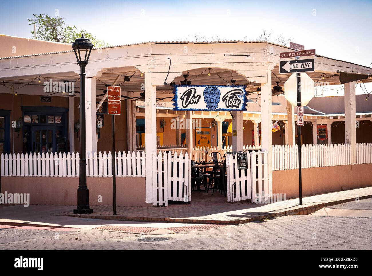 Entrance to the historic restaurant, the Don Felix Cafe, with patio seating and white picket fence, serving New Mexican cuisine, in Mesilla, NM, USA Stock Photo