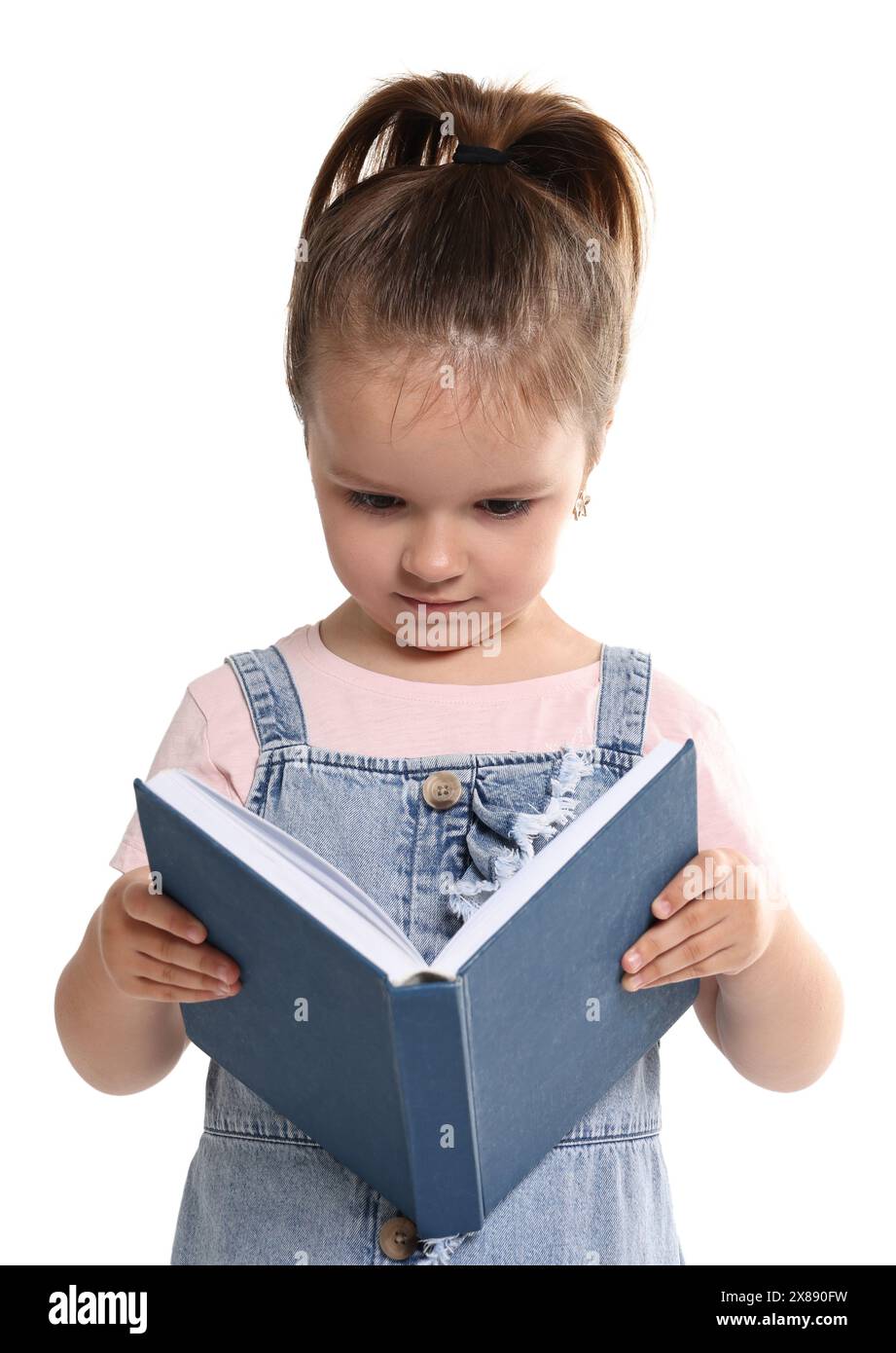 Cute little girl reading book on white background Stock Photo - Alamy