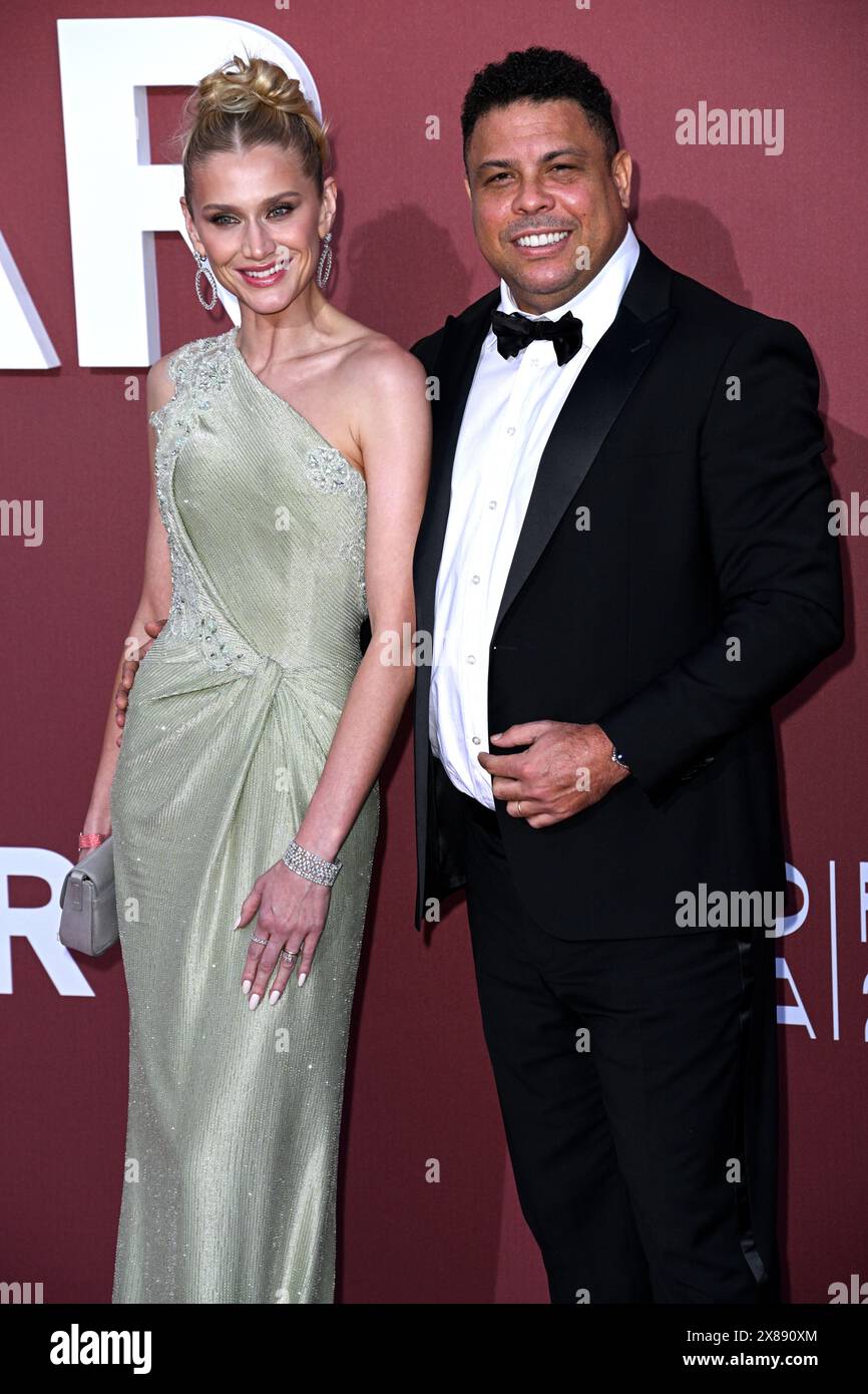 Cannes, France. May 23rd, 2024. Celina Locks and Ronaldo Luís Nazário de Lima arriving at the 2024 amfAR Gala Cannes, Hotel du Cap Eden Roc. Part of the 77th edition of The Cannes Film Festival. Credit: Doug Peters/EMPICS/Alamy Live News Stock Photo