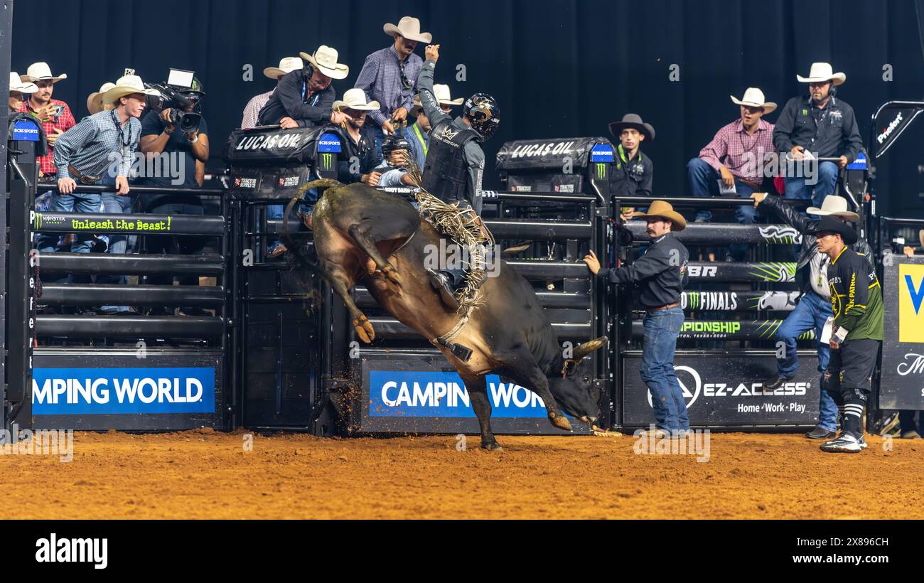 PBR World Finals 2024 in Dallas, Texas Bullfighter hanging on for