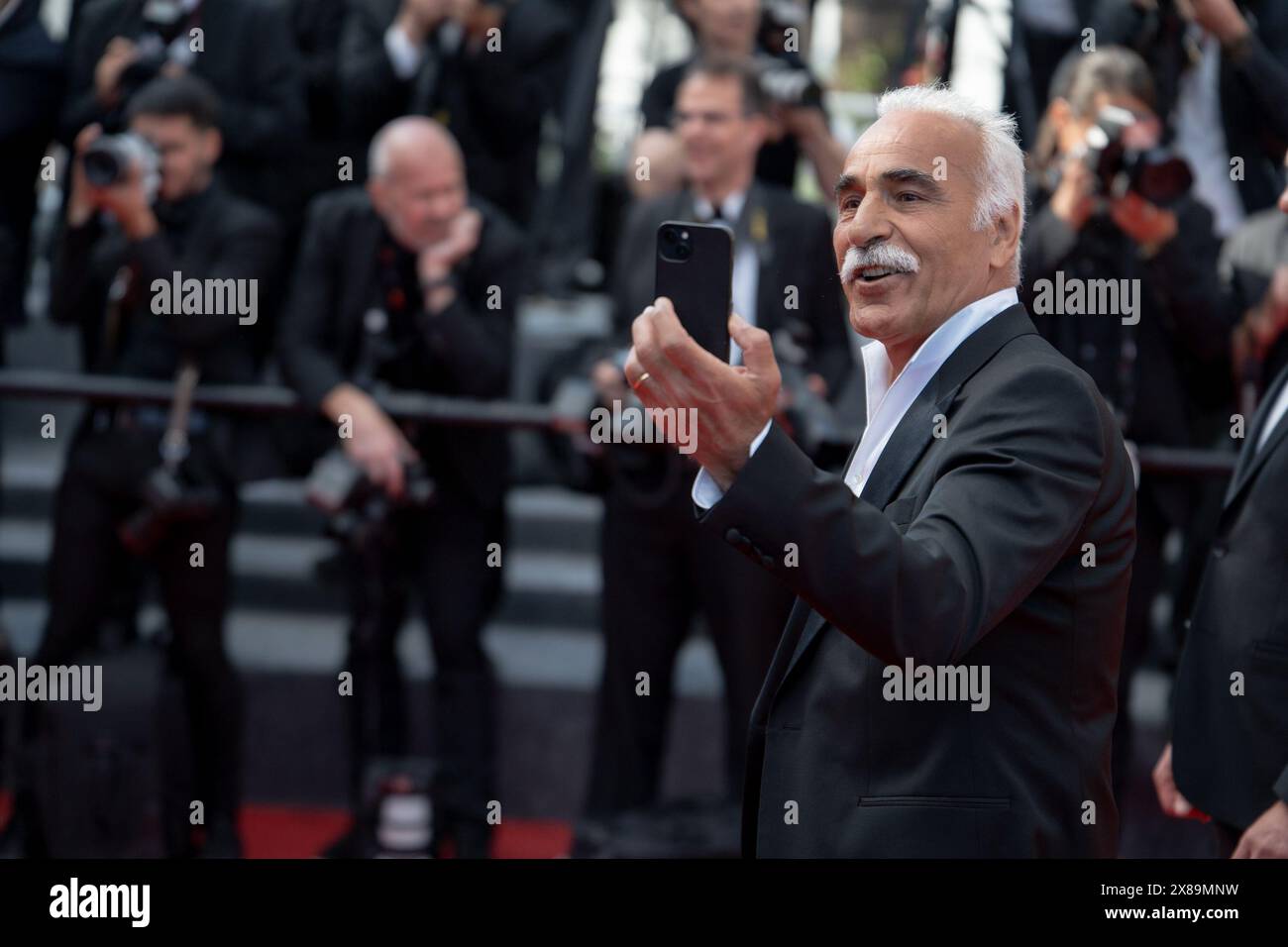 Cannes, France. 23rd May, 2024. Mansour Bahrami is attending the ''L'Amour Ouf'' (Beating Hearts) Red Carpet at the 77th annual Cannes Film Festival at Palais des Festivals in Cannes, France, on May 23, 2024. (Photo by Luca Carlino/NurPhoto) Credit: NurPhoto SRL/Alamy Live News Stock Photo