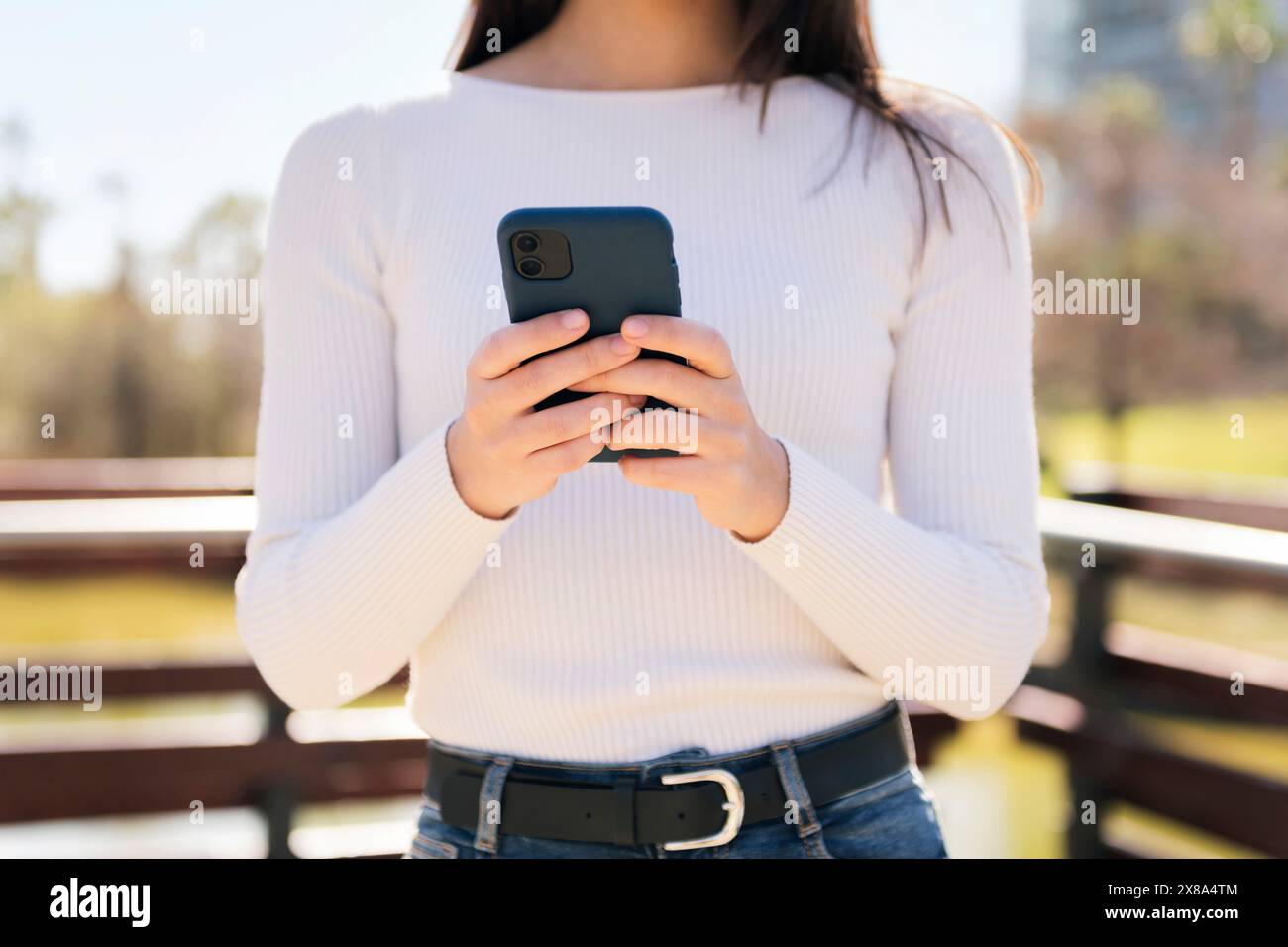 unrecognizable woman using mobile phone Stock Photo