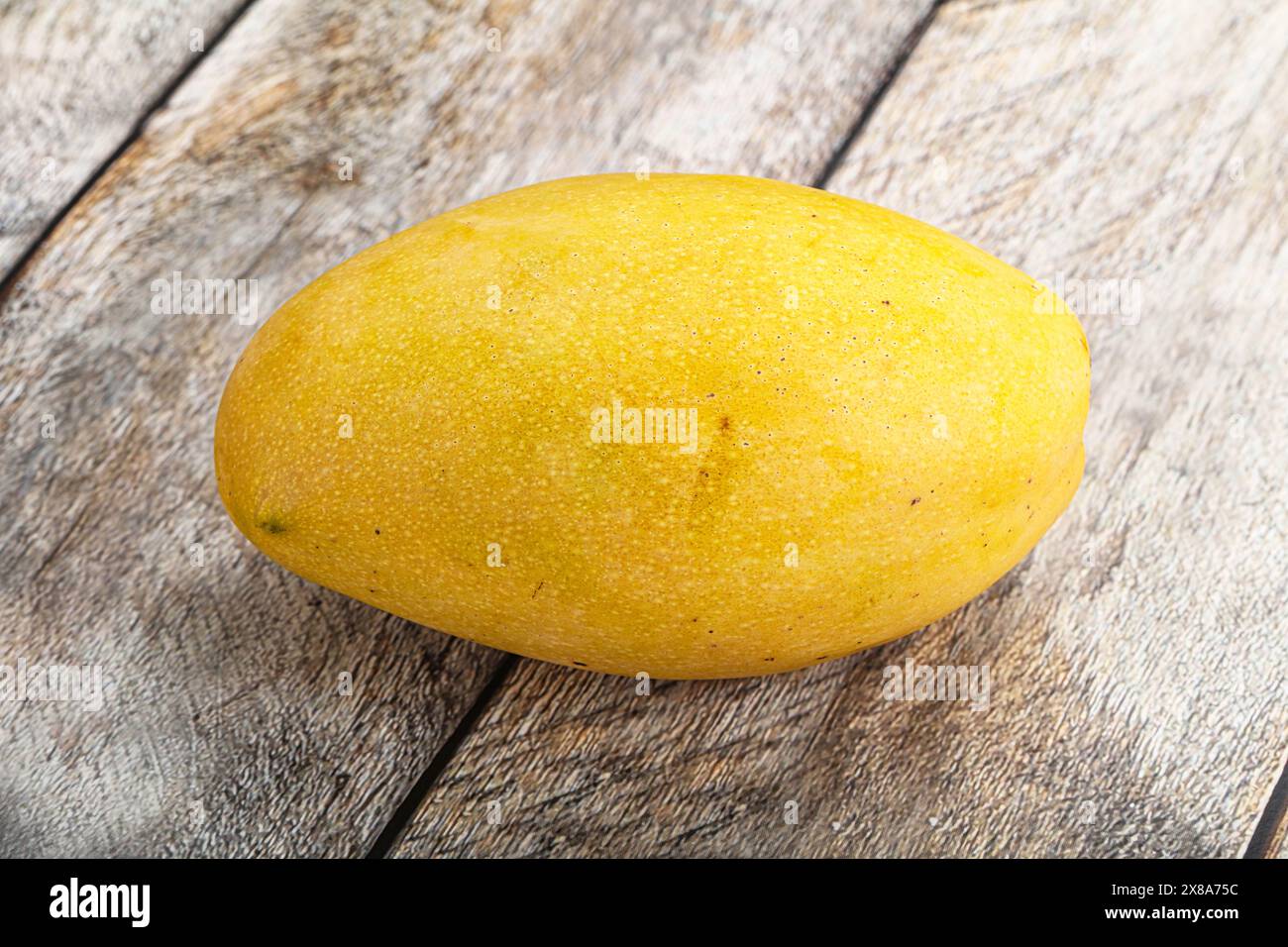 Sweet ripe juicy tropical yellow mango fruit Stock Photo - Alamy