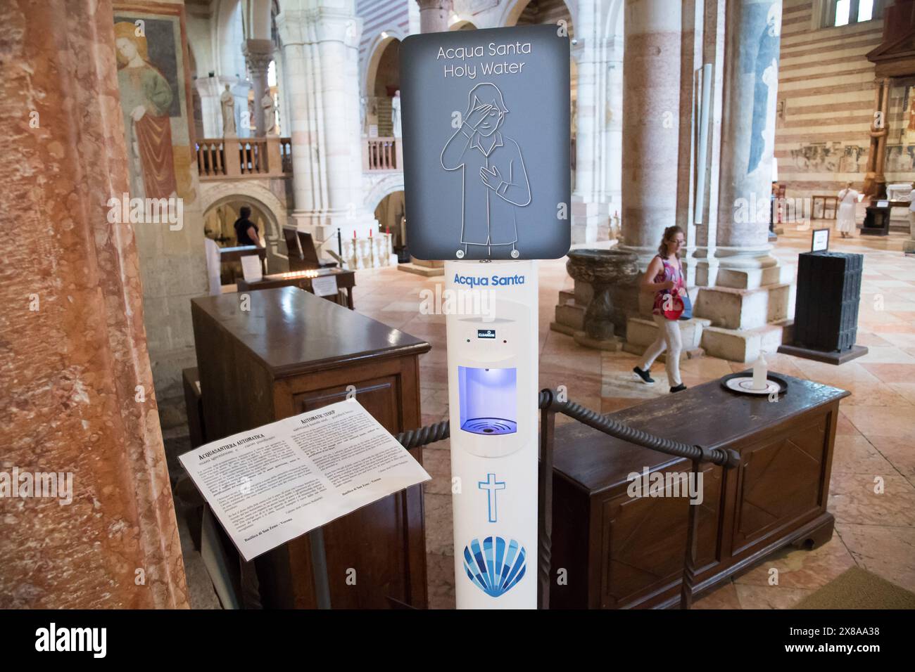 Automatic touchless Holy Water dispenser in Romanesque Basilica di San