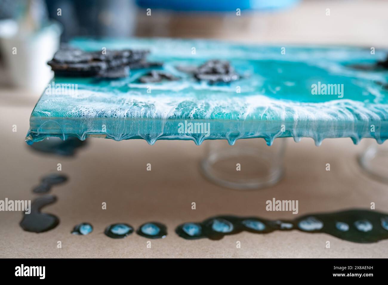 Finished painting dries after being poured with epoxy resin closeup