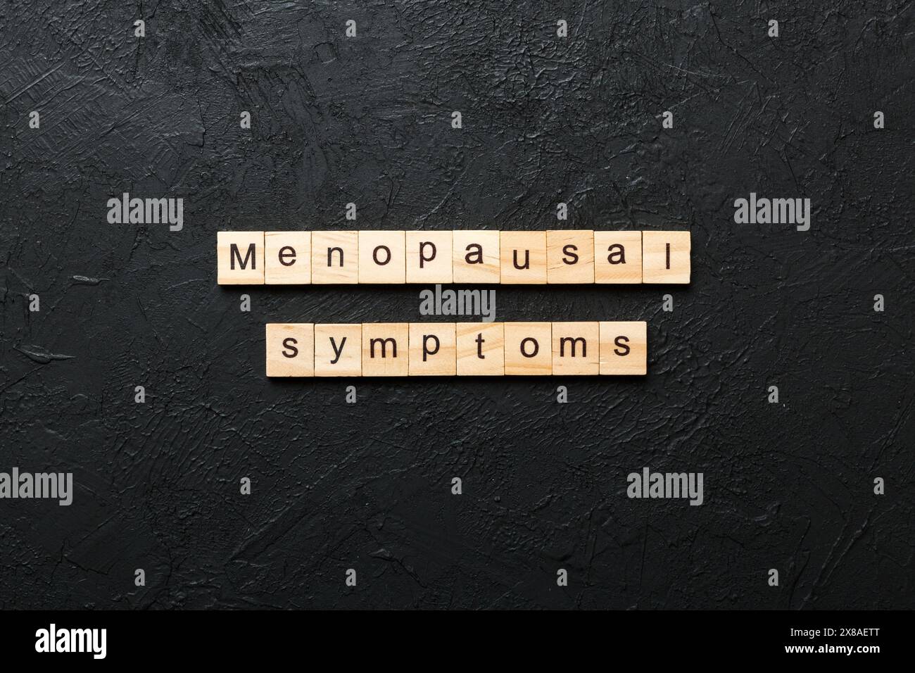 menopausal symptoms word written on wood block. menopausal symptoms ...
