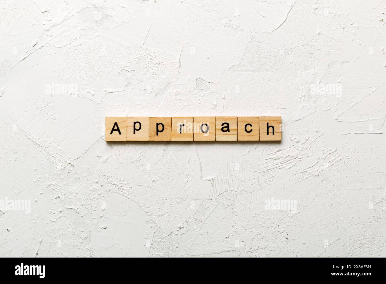 APPROACH word written on wood block. APPROACH text on cement table for ...