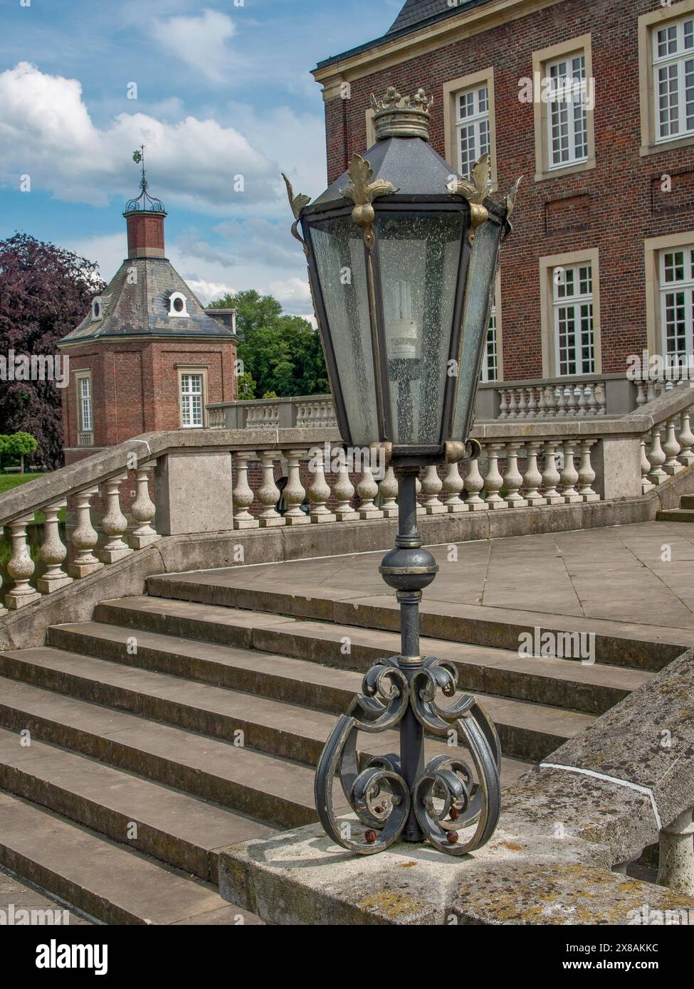 Castle Railing Torret Close-up view of an antique lantern on a railing next to stone steps in ...
