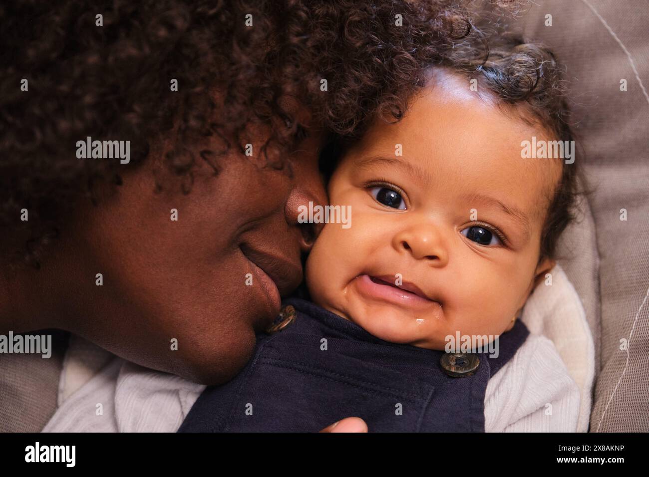 African woman with her baby girl, scene is warm and loving. Stock Photo