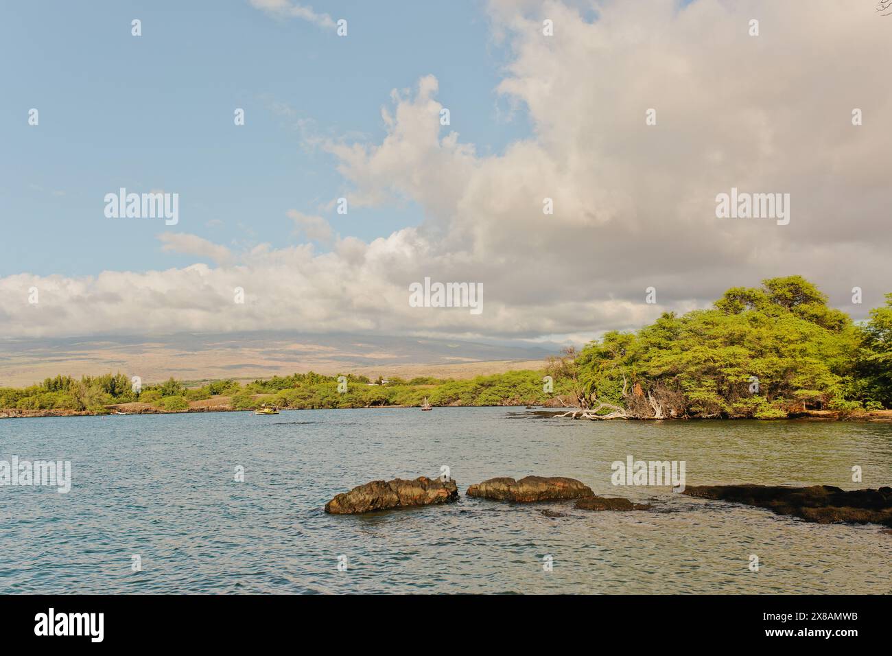 Hawaiian Coast Line at Sun Sets with Vibrant Greens and Blue Ocean Stock Photo