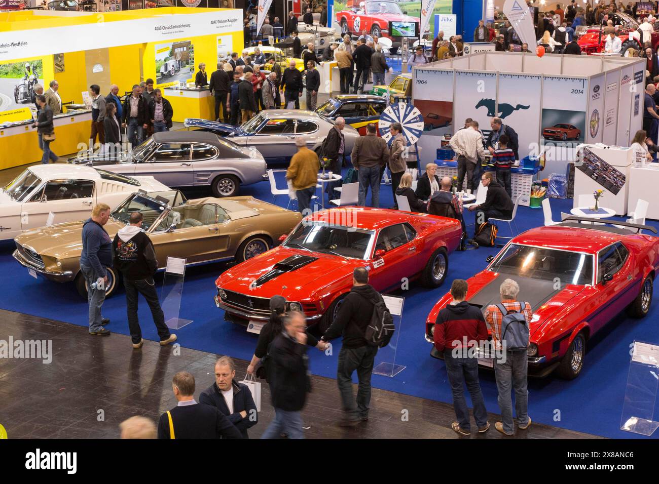 Visitors to Techno Classica take a look at Ford models such as the Mustang and Capri. Techno Classica is the trade fair for vintage, classic and prest Stock Photo