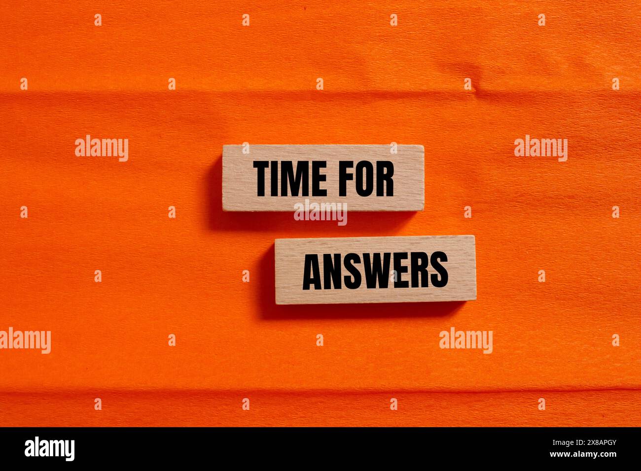 Time for answers words written on wooden blocks with orange background ...