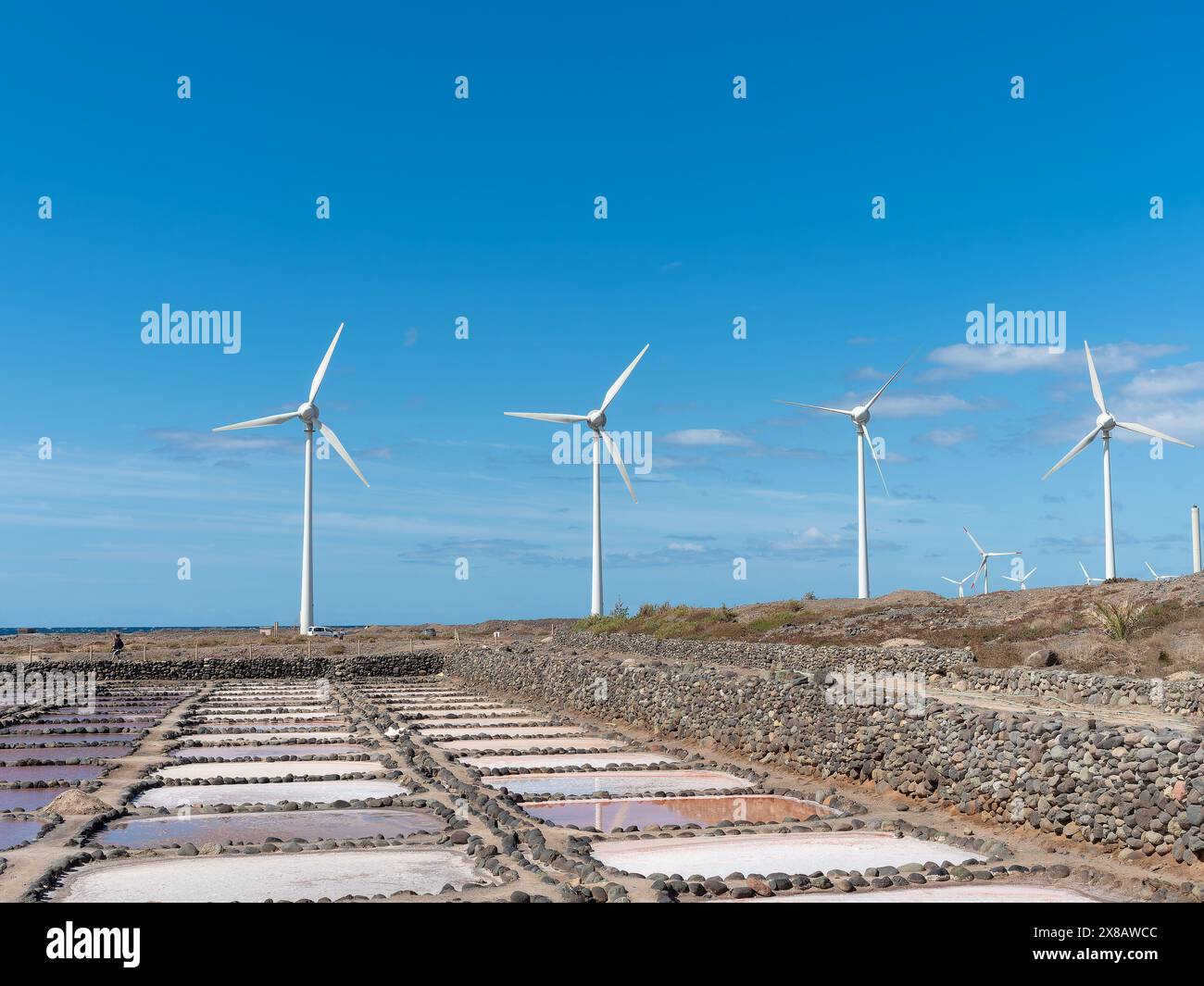 Panoramic view of the old salt mines of Tenefé and windmills in Gran Canaria Stock Photo