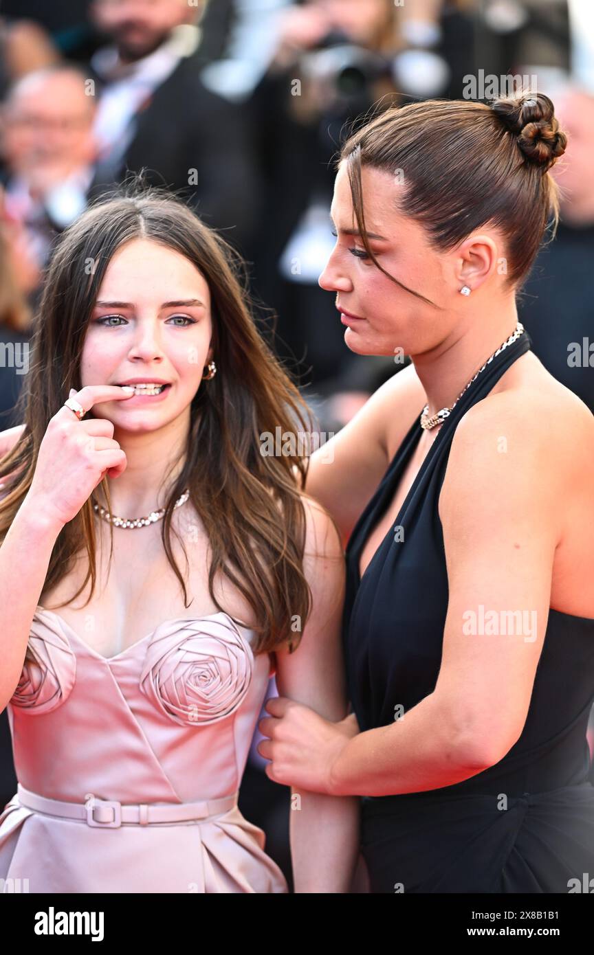 Mallory Wanecque and Adele Exarchopoulos attend the 'L'Amour Ouf' (Beating Hearts) Red Carpet at the 77th annual Cannes Film Festival at Palais des Fe Stock Photo