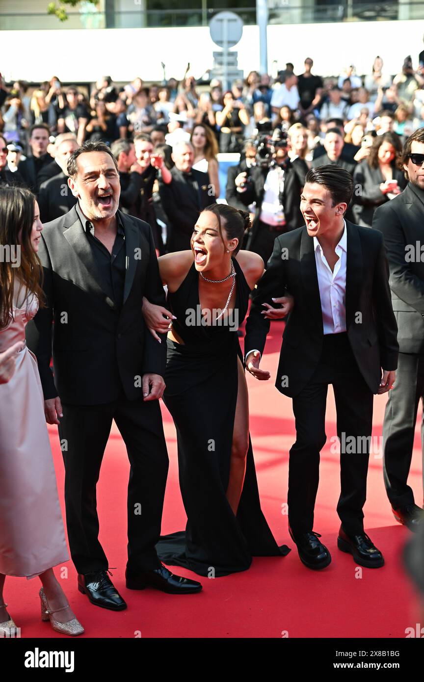 Malik Frikah, Adele Exarchopoulos, Gilles Lellouche attend the 'L'Amour Ouf' (Beating Hearts) Red Carpet at the 77th annual Cannes Film Festival at Pa Stock Photo