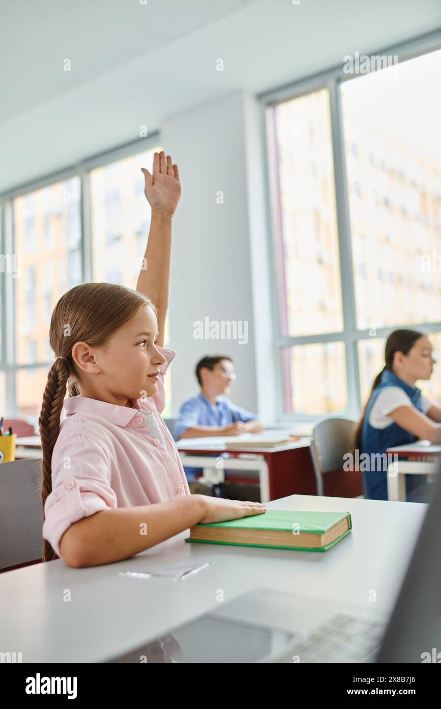 A young girl with long hair raises her hand in a colorful, lively ...