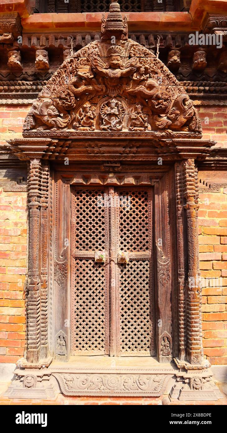 Wooden Carvings of Mahishasurmardini and Garuda on Entrance gate, Mulchowk, Patan Darbar Square, Patan, Kathmandu, Nepal. Stock Photo