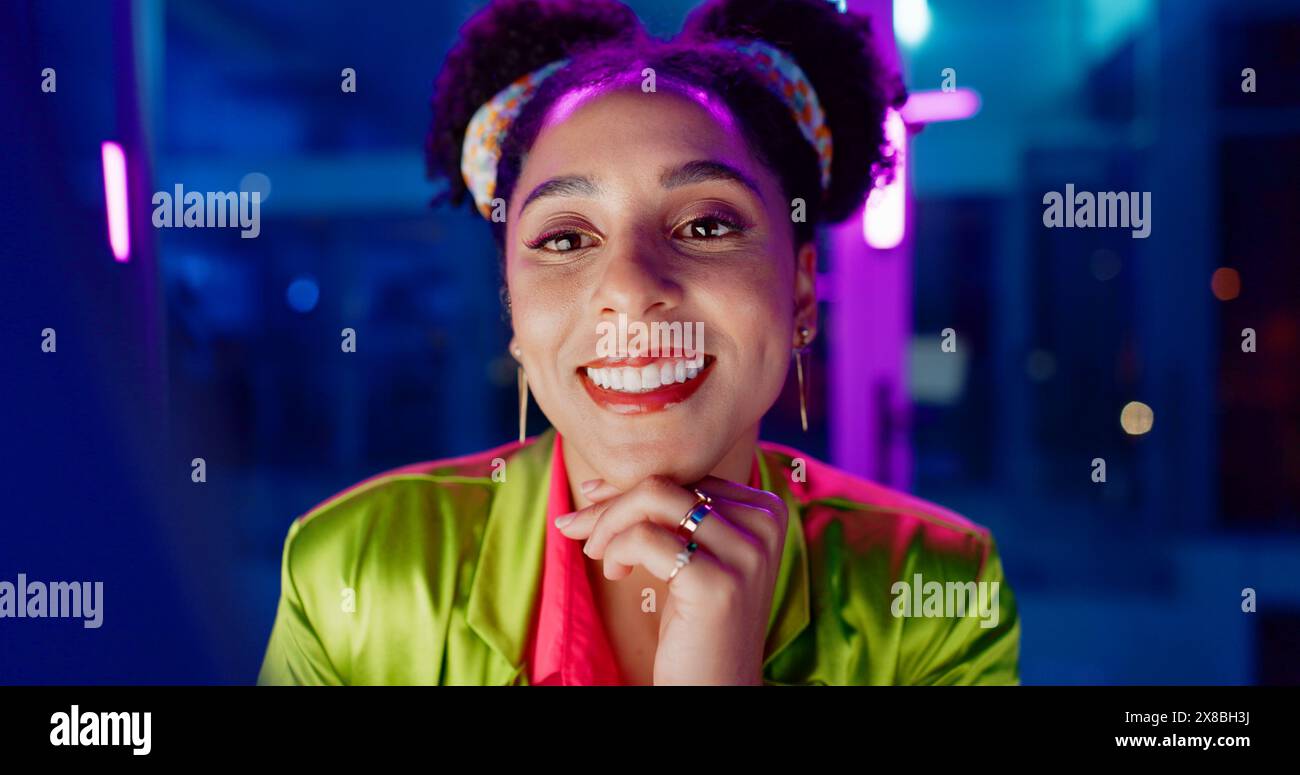 Woman, night and excited in office with neon, tablet or scroll for reading with problem solving at coding job. Person, girl and developer with click Stock Photo