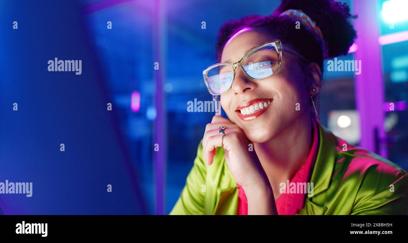Woman, night and smile in office with neon, tablet and glasses for reading, information technology or coding. Person, girl and developer with click Stock Photo