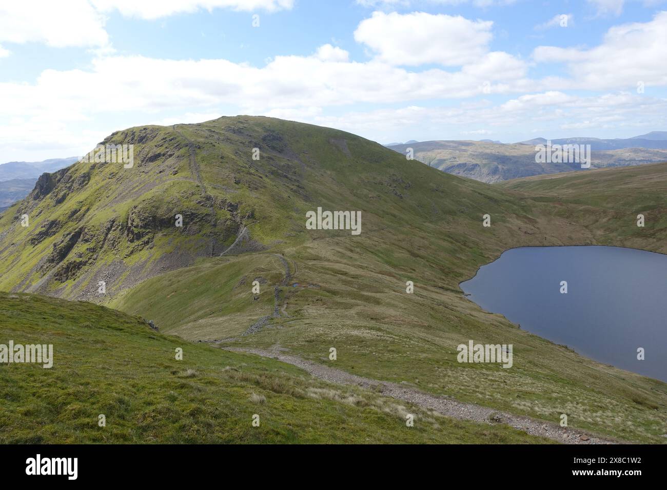 The Wainwright 'Seat Sandal' with Grisedale Tarn & Grisedale Hause from Path to 'Fairfield' in the Lake District National Park, Cumbria, England, UK. Stock Photo