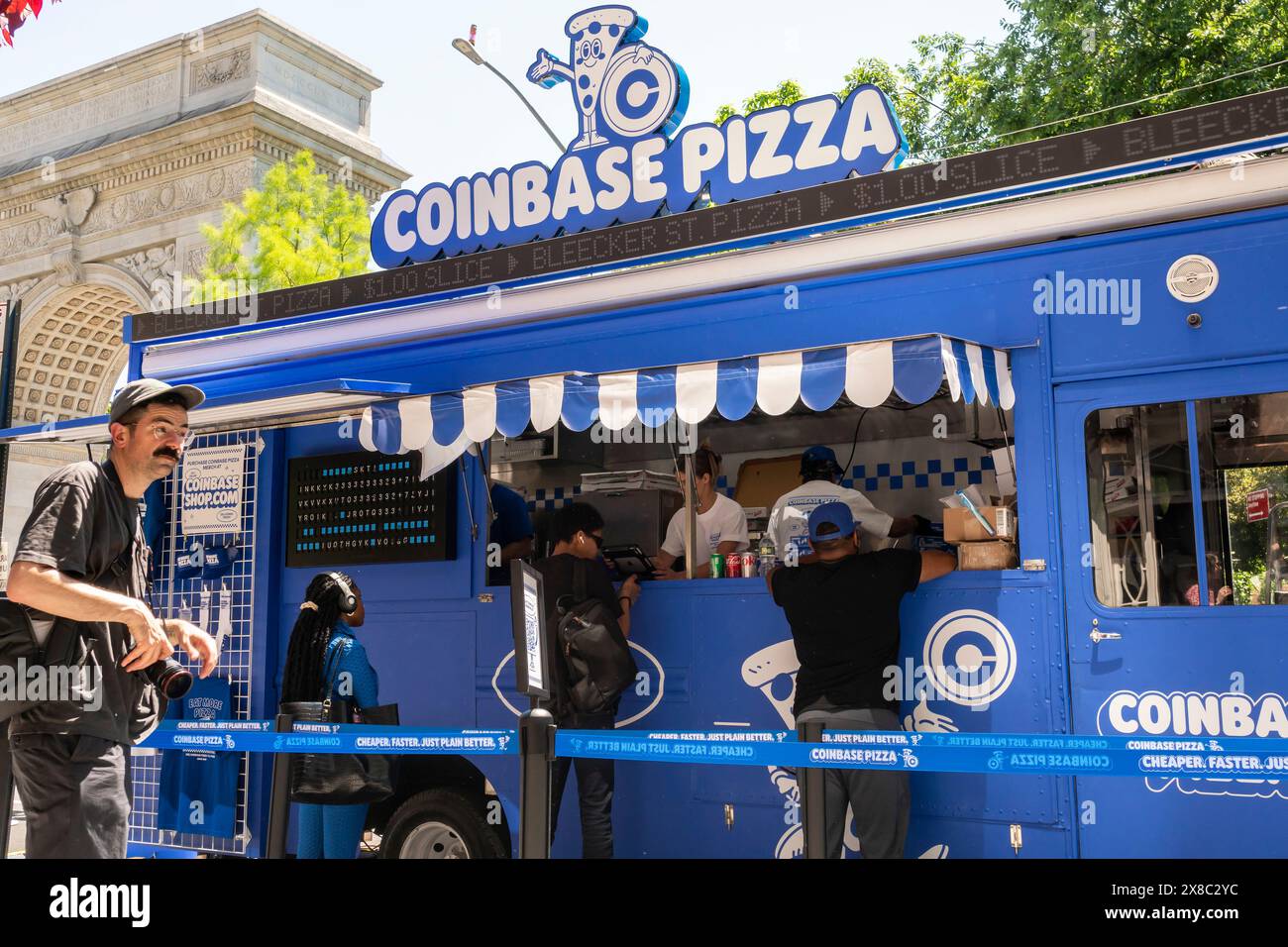 Brand activation for the cryptocurrency exchange Coinbase in Greenwich  Village in New York on Wednesday, May 22, 2024. By downloading the Coinbase  Wallet onto their phones participants could buy a slice of