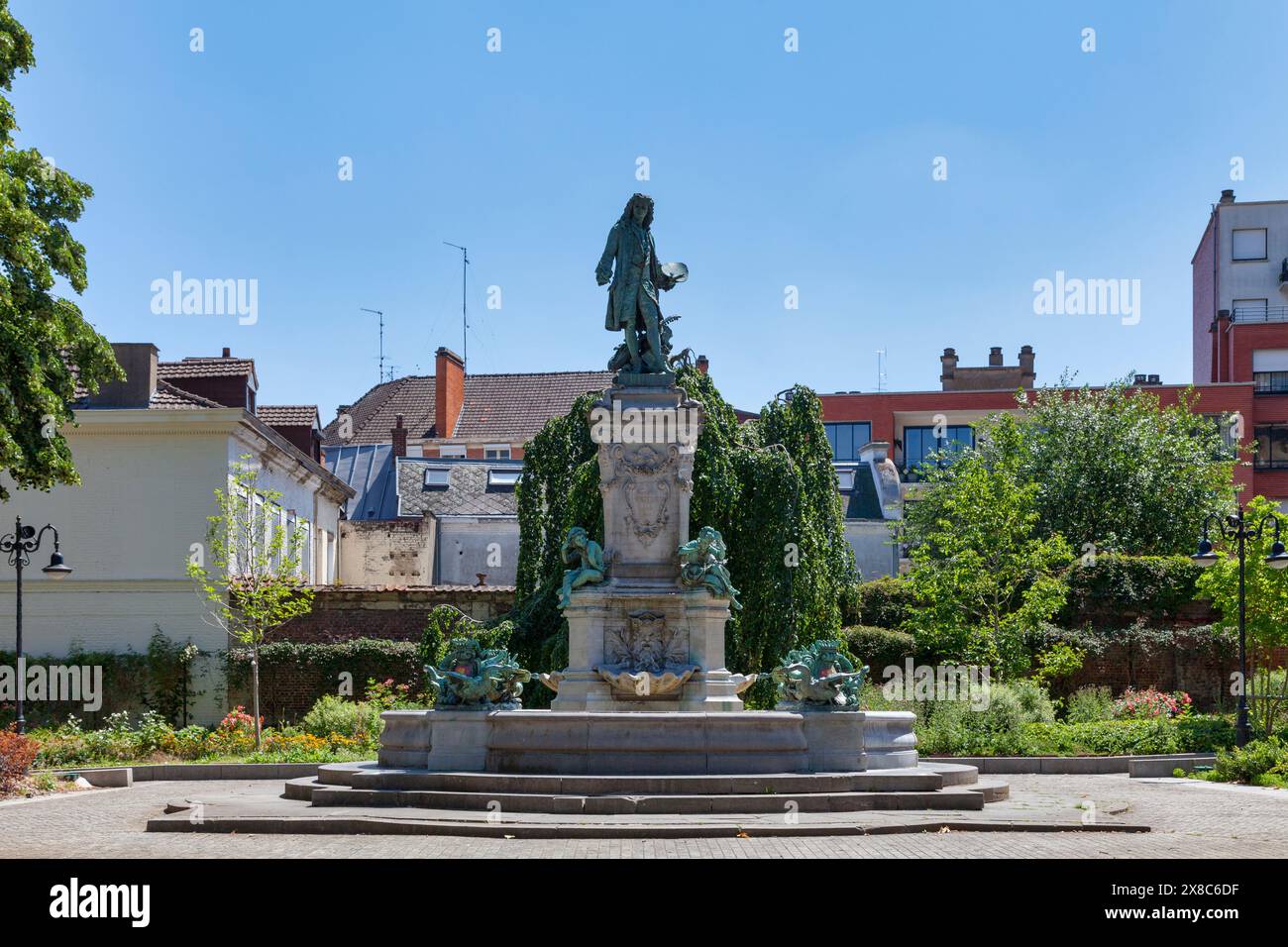 Valenciennes, France - June 23 2020: The Monument to Watteau by sculptor Carpeaux was inaugurated in 1884 in front of the Saint-Géry Church. Stock Photo