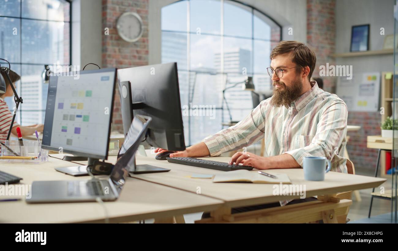 Male manager working in spacious hi-res stock photography and images ...