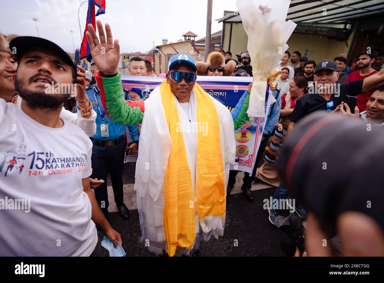 Kathmandu, Nepal. 24th May, 2024. Legendary Mountaineer Kami Rita Sherpa waves at people as he arrives after scaling Mt Everest for the 30th time, leading the world record of most ascents on the world's highest peak Mount Everest at Tribhuvan International Airport. Kami Rita Sherpa, considered one of the greatest mountain guides, reached the 8,849-meter (29,032-foot) summit at 7:49 AM local time on Wednesday 22 May, 2024 according to expedition organizer Seven Summits Treks. (Photo by Prabin Ranabhat/SOPA Images/Sipa USA) Credit: Sipa USA/Alamy Live News Stock Photo
