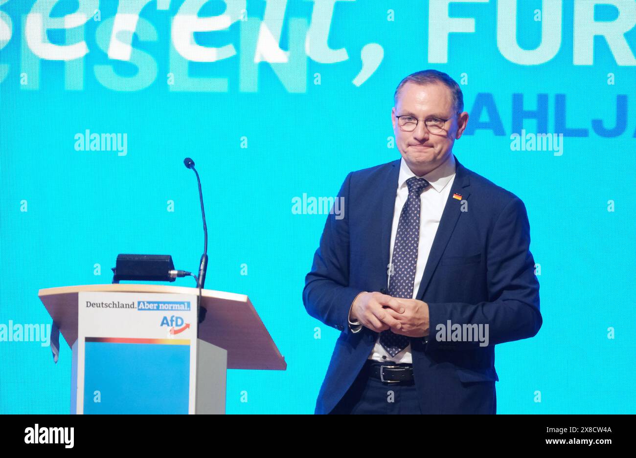 Glauchau, Germany. 24th May, 2024. Tino Chrupalla, Federal Chairman of the AfD, is on stage at the Saxon AfD state party conference. A new state executive committee will be elected there. Credit: Sebastian Willnow/dpa/Alamy Live News Stock Photo