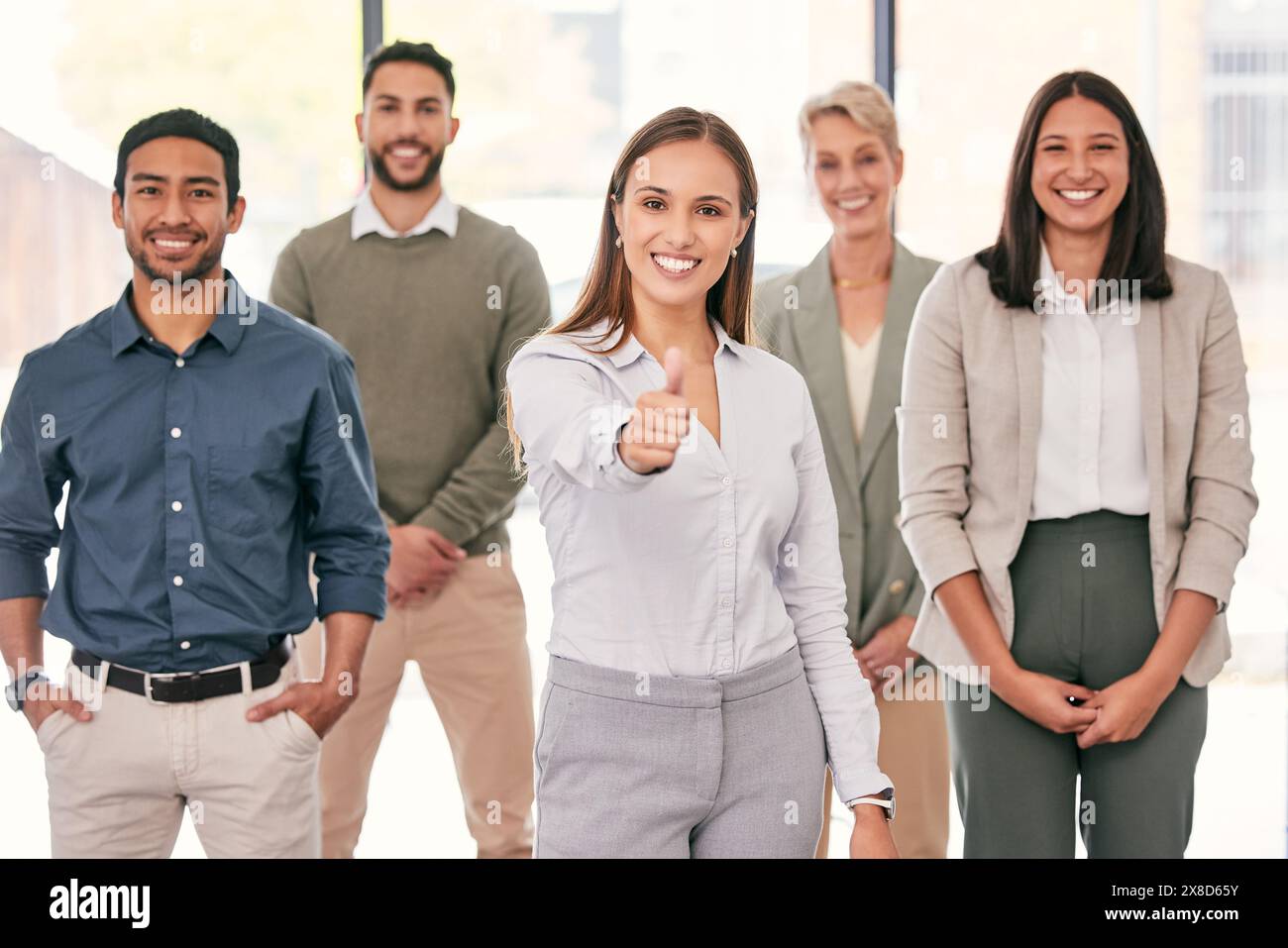 Smile, thumbs up and portrait of business people in workplace in ...