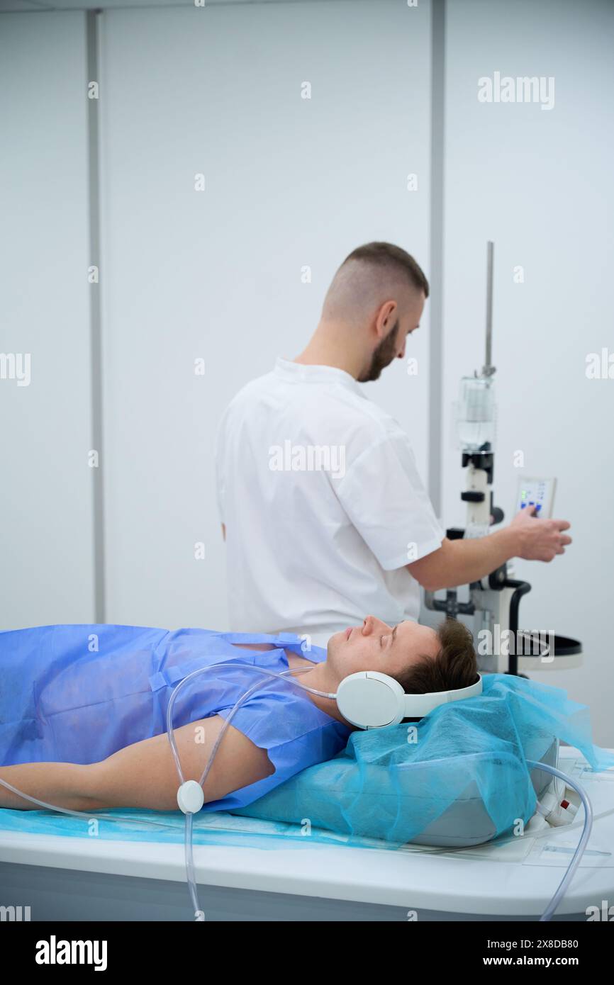 Radiographer is preparing adult man for contrast-enhanced MRI Stock ...