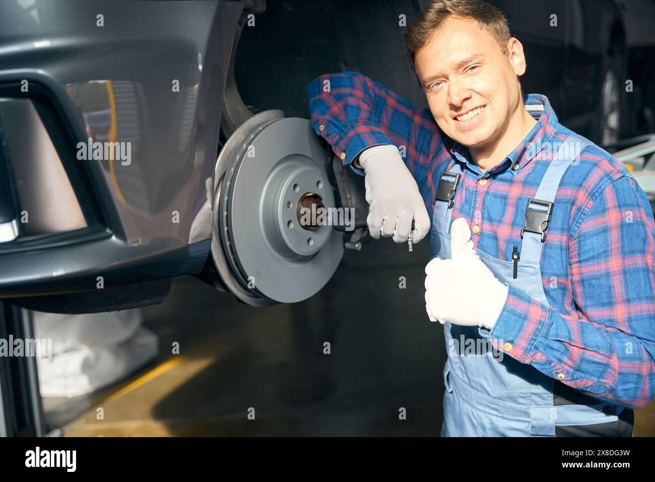 Mechanic leaning on machine hi-res stock photography and images - Alamy
