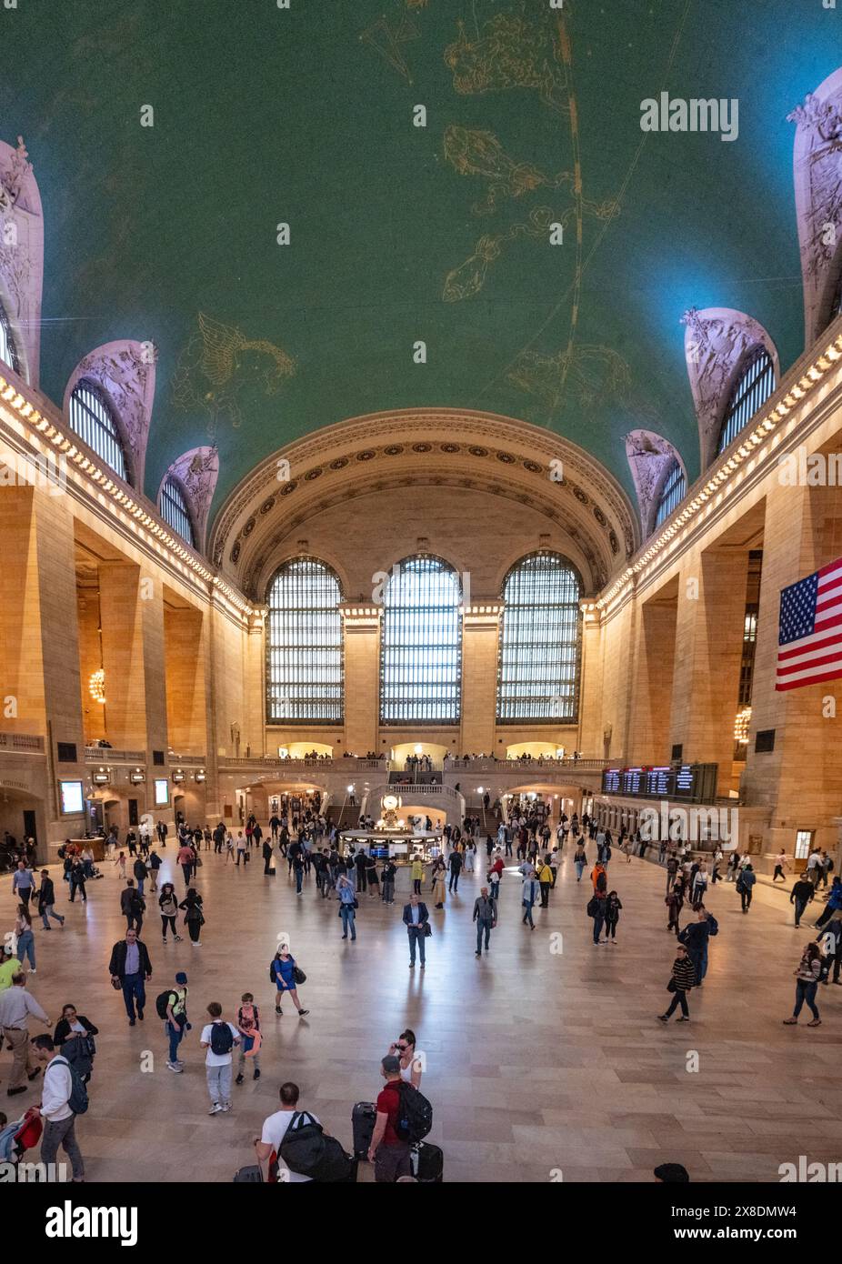 New York, New York, United States - 04 09 2024: Grand Central's vibrant heart! Commuters navigate the iconic terminal's grand hall. Stock Photo