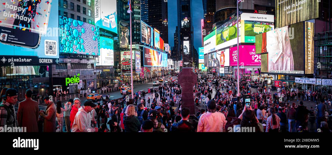 New York, New York, United States - 04 09 2024: NYC's dazzling Times Square! Blinding lights and vibrant ads captivate a buzzing crowd. Stock Photo