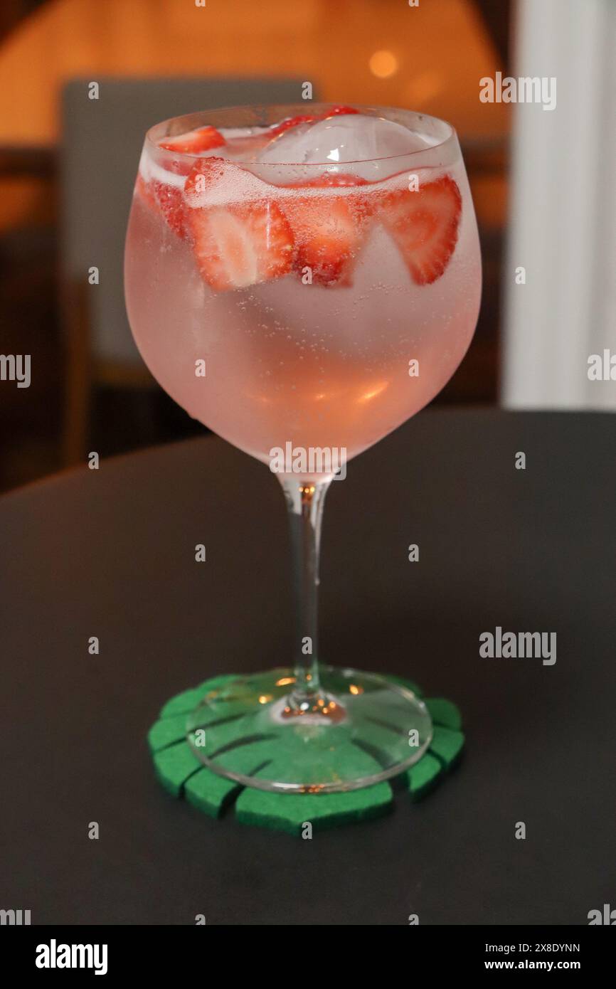 Strawberries in glass white wine hi-res stock photography and images ...