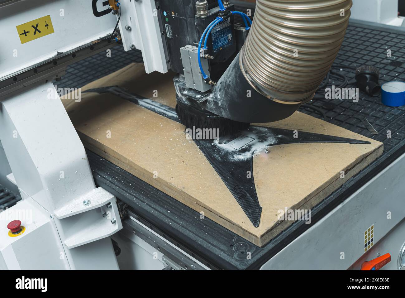 automatic milling machine working on modern carbon fiber guitar in the factory. High quality photo Stock Photo