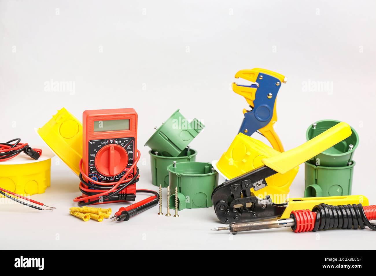 Different electrician's tools on light background Stock Photo
