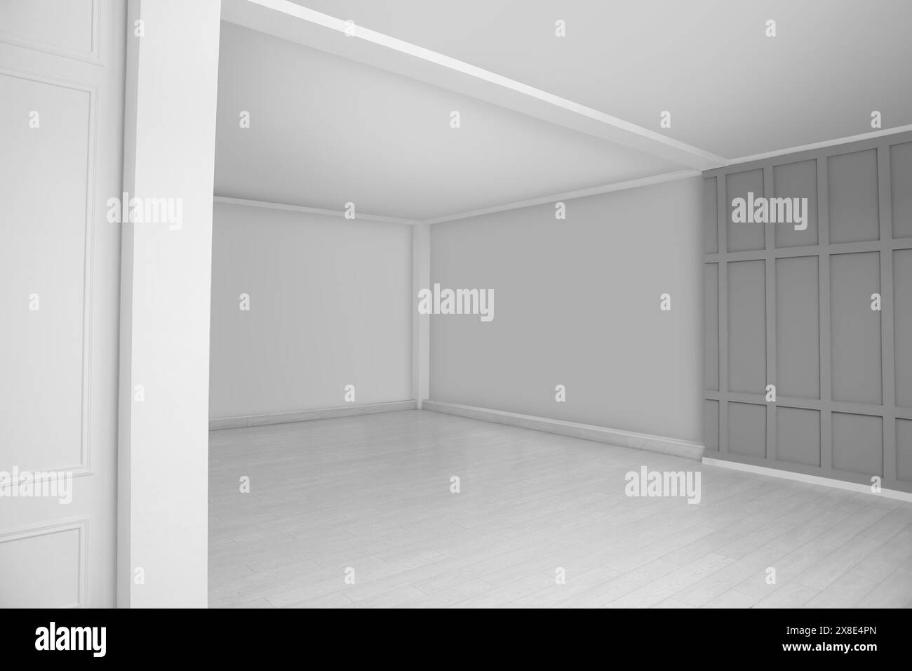 Empty room with grey wall and laminated floor Stock Photo - Alamy