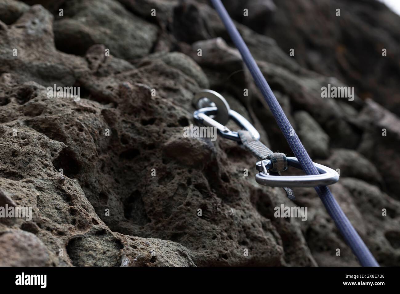 Rock climbing safety equipment, dynamic rope and carabiner fixed on ...