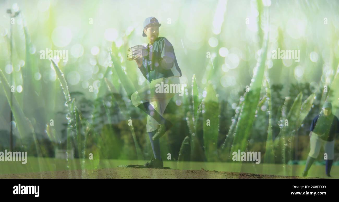Biracial child in baseball gear stands on pitcher's mound, glove in hand Stock Photo