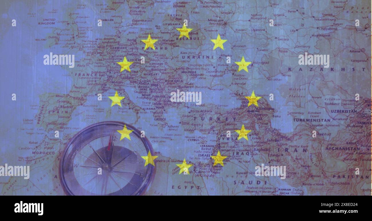 Compass resting on Europe map, yellow stars marking spots Stock Photo