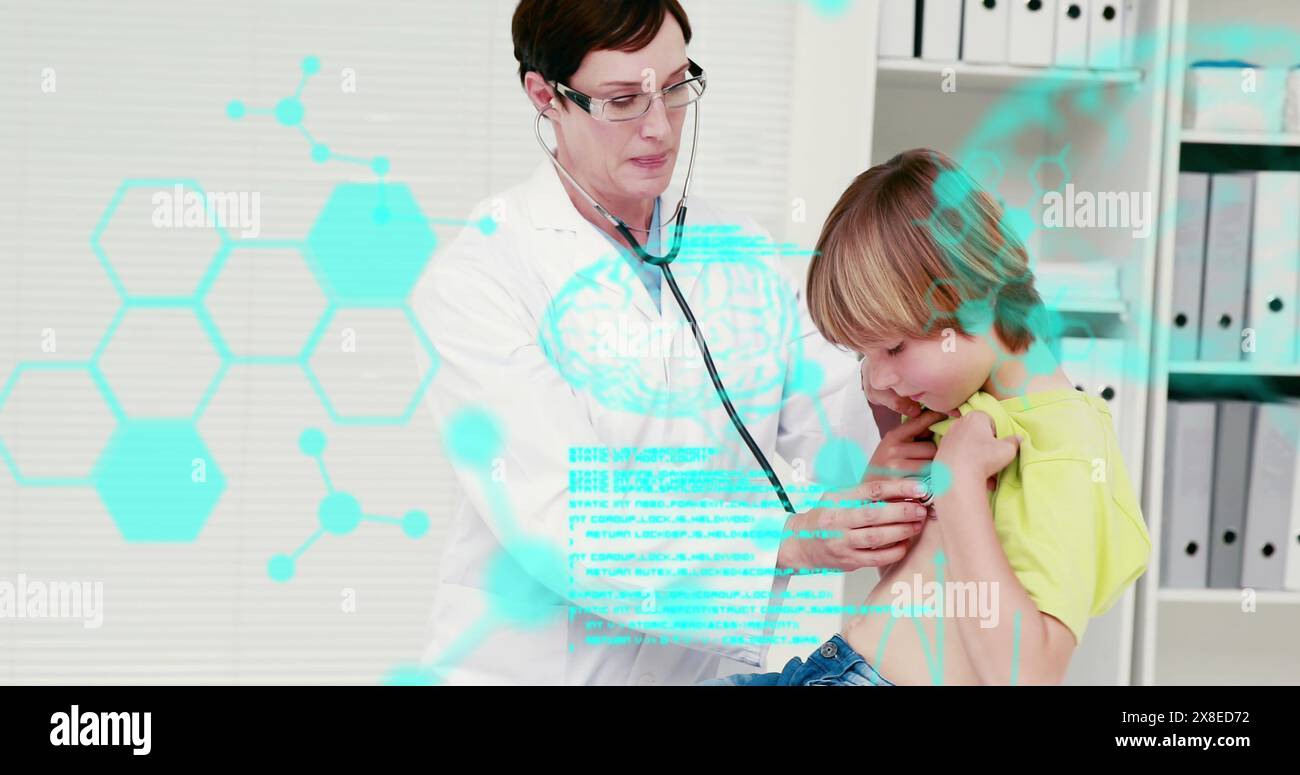 Caucasian mother wearing glasses, examining her son with stethoscope Stock Photo
