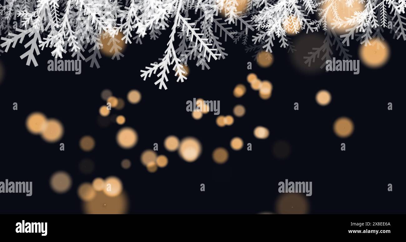 Image of white tree leaves over orange spots of light against black background Stock Photo