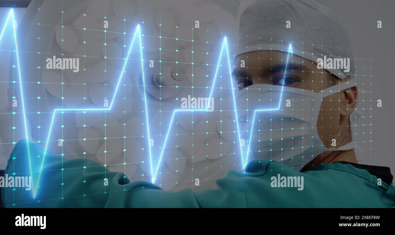 Image of heart rate monitor over biracial male surgeon in operation theatre at hospital Stock Photo