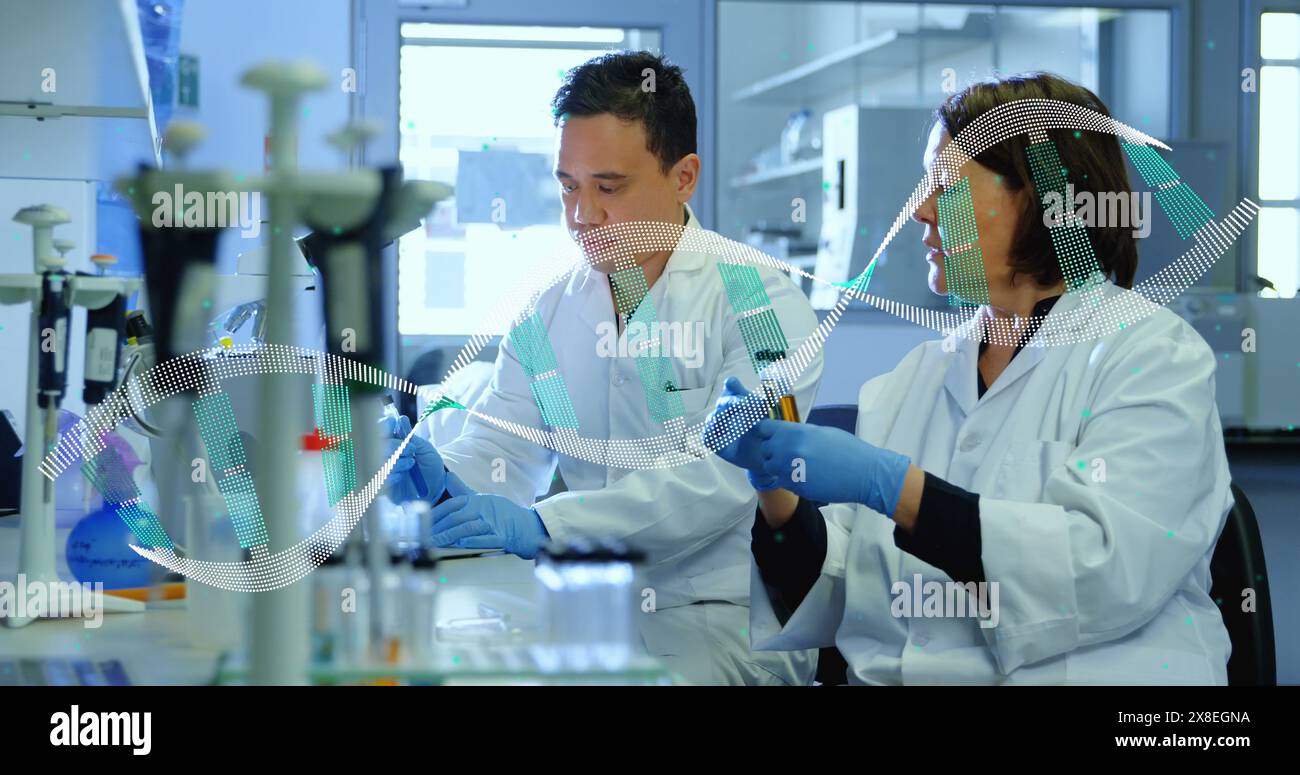Image of dna helix over diverse scientists discussing about sample in laboratory Stock Photo