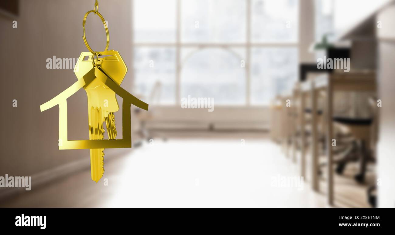 Image of hanging golden house keys against interior of a classroom Stock Photo